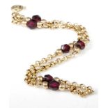 A lady's 9ct gold and faceted garnet set belcher link bracelet, 2.2g, length 19.5cm