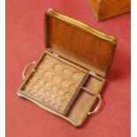 An oak and brass handled lift-up lid coin storage box, with removable interior tray