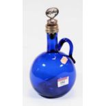 A late 19th century Bristol blue glass decanter, of mallet form, having loop handle and white