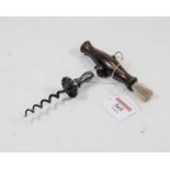 A George III corkscrew having a steel worm, the turned mahogany barrel shape handle with brush,