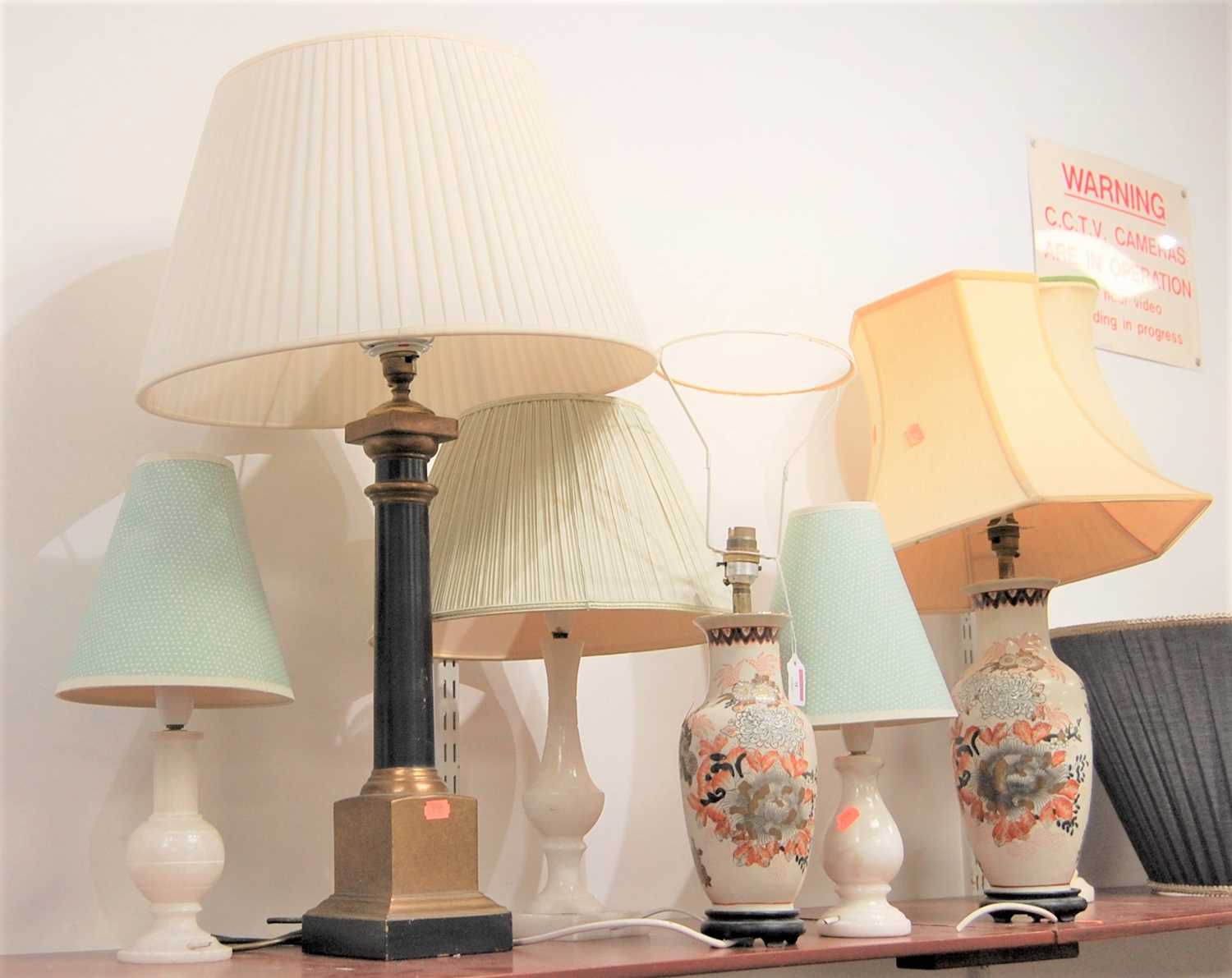 A collection of table lamps to include two in the Imari palette, three alabaster, one marble and one