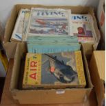 Two boxes containing a quantity of mixed military ephemera and books, to include 1930s Popular