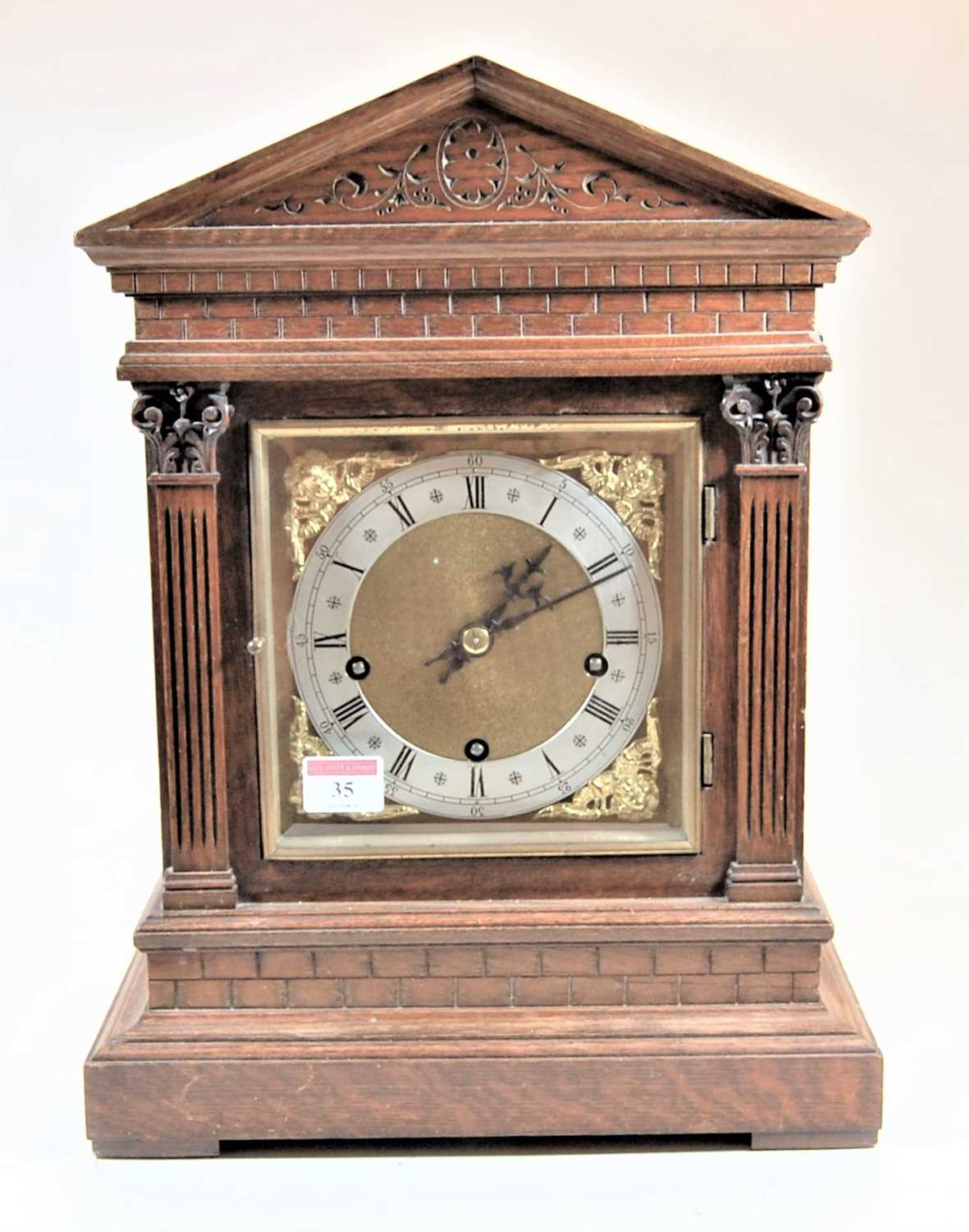 A circa 1900 oak cased bracket clock by Winterhalder & Hofmeier having a square brass dial with