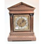 A circa 1900 oak cased bracket clock by Winterhalder & Hofmeier having a square brass dial with