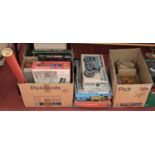 A large collection of assorted plastic kits, board games, and childrens toys, to include a boxed