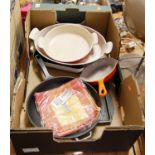 A box of miscellaneous kitchenalia to include Britannia griddle, various oven dishes