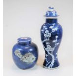 A Chinese stoneware blue and white vase, of baluster form, decorated with peonies, h.30cm;