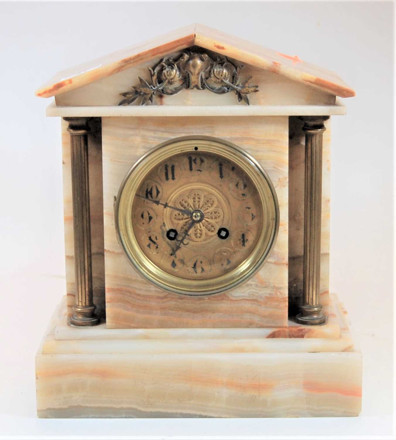 An early 20th century onyx cased architectural mantel clock having unsigned brass dial, and French