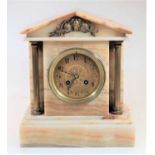 An early 20th century onyx cased architectural mantel clock having unsigned brass dial, and French