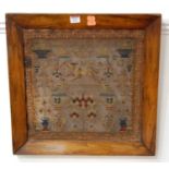 A Victorian framed needlework sampler