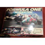 A Scalextric boxed Formula 1 race-car gift set (missing one car otherwise appears near-complete)