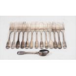 A collection of 19th century silver dessert forks, in the Fiddle pattern, some with monogrammed