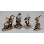 A collection of three Royal Crown Derby bird figures, comprising Thrush chicks, Blue-tit, and
