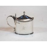A Victorian silver mustard, of oval form, having blue glass liner, the cover with acorn finial and