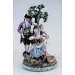 A late 19th century Continental porcelain figure group 'The Apple-pickers', the gent in standing