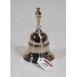 A George V silver table bell, of typical form, with banded decoration and silver clapper, weight 6.