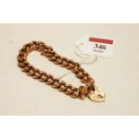 A 9ct gold curblink bracelet with heart shape clasp, 23.2g