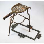 A 19th century brass and iron trivet with turned fruitwood handle, height 32cm, together with bronze