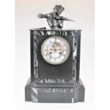 An early 20th century slate mantel clock surmounted with a bronze composition figure of a coal