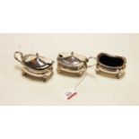 Three silver cruets, comprising boat-shaped open salt with liner, and two boat-shaped mustards