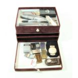 A red felt clad two drawer table top collectors' chest contents to include pocket cigar cutter,
