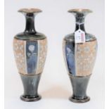 A pair of Royal Doulton Lambeth stoneware vases each with impressed circle and lion mark verso,