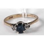 A modern 9ct gold, four-claw set sapphire and diamond point dress ring, size J, 1.4g