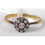 A yellow metal diamond flower head cluster ring, arranged as nine old cut diamonds, total diamond