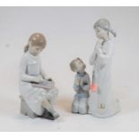 A Lladro Spanish porcelain figure of two young children praying, printed mark verso, h.22cm;