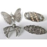 Three marcasite set brooches; together with a filigree butterfly brooch (4)