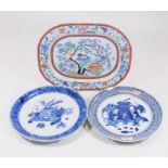 A blue and white plate, in the Chinese style, the centre decorated with a vase issuing flowers