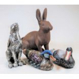 One painted composition decoy duck, one other ceramic example, silvered composition model of a