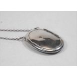 A lady's silver powder compact, on long belcher link neck chain, 1.5oz