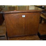 An early 20th century stained pine hinge topped work box, having end carry handles, w.49cm