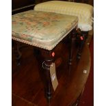 Two 19th century mahogany dressing stools, each with upholstered stuffover seats and on turned