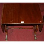 A reproduction mahogany low dropflap occasional table, raised on lyre end supports, w. 56cm (