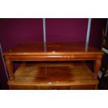 A reproduction mahogany rectangular low coffee table, length 124.5cm