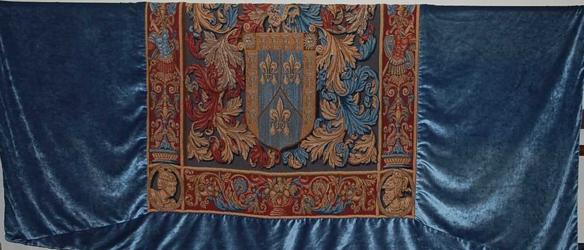 A large Continental embroidered tapestry wall hanging, with velour deep bordered surround, approx.