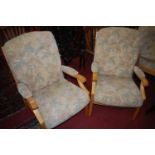 A contemporary ash framed and floral cushioned upholstered three-piece lounge suite, comprising