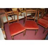 A set of six late Victorian oak dining chairs, having stuff over seats raised on ring turned