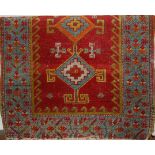 A small Persian red ground woollen rug, 80 x 56cmCondition report: Worn and with repairs to edges,