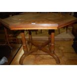 A Victorian Aesthetic Movement oak and further geometric inlaid octagonal centre table, raised on