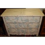 A contemporary French distressed white painted chest, of three long drawers with cast pierced