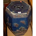 A Chinese blue glazed stoneware hexagonal barrel seat (with losses and damage), h.50cm