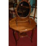 An Edwardian walnut shaped octagonal top two-tier centre table, on acanthus leaf cabriole