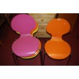 A set of four contemporary bright colour painted ply and tubular chrome stacking café chairs