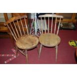 A set of four early 20th century elm and beech stickback kitchen chairs