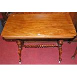 A Victorian mahogany round cornered hall table, raised on turned end supports united by a spiral