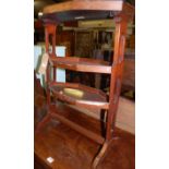 A circa 1900 mahogany and brass applied three-tier etagere, each platform of octagonal faceted form,