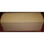 A contemporary cream floral upholstered domed hinge top ottoman, width 123cm